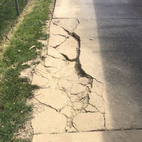 Concrete slab crumbling and cracked due to heavy trauma