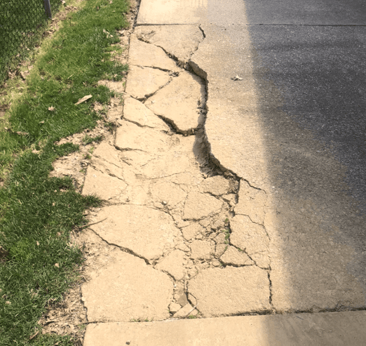 Concrete slab crushed by heavy equipment