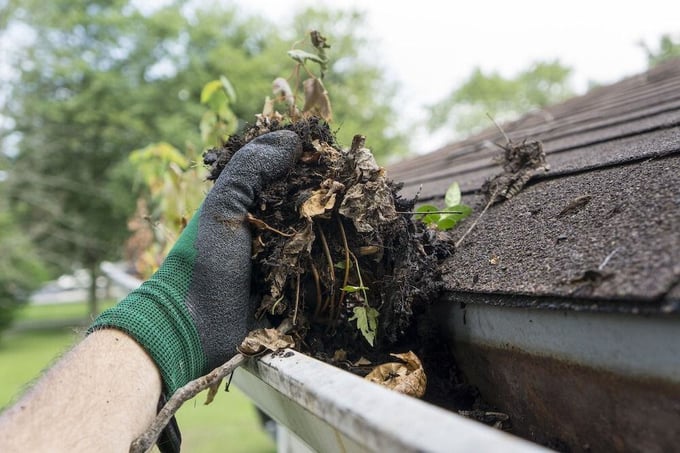 Removing debris and dirt from gutter