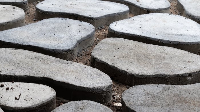 Concrete paver pathway on top of soil base