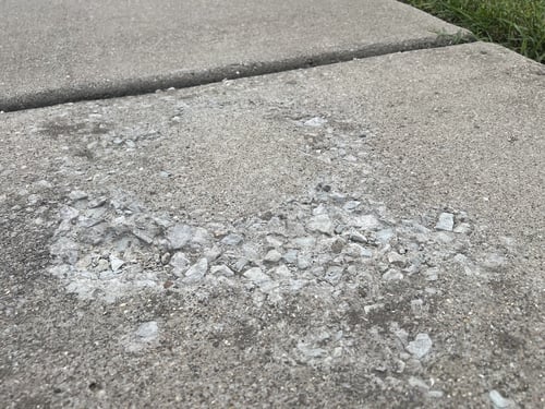 Spalling surface damage on concrete slab