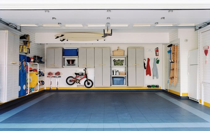 Organized garage with storage cabinets