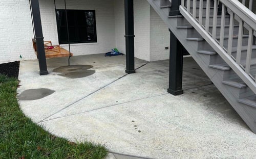 Water puddling and pooling on concrete patio